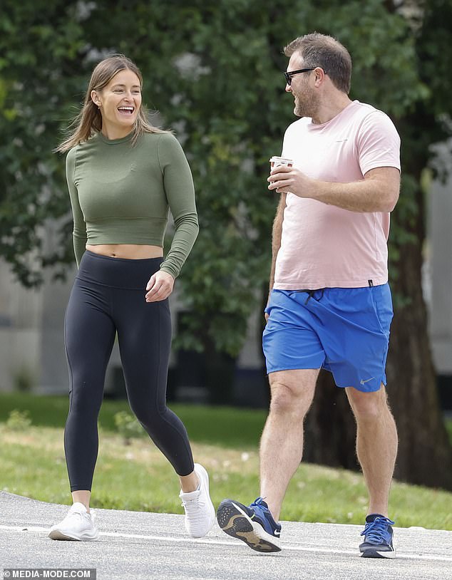 The footy great and his companion appeared to be in good spirits as they enjoyed some exercise and a cup of coffee