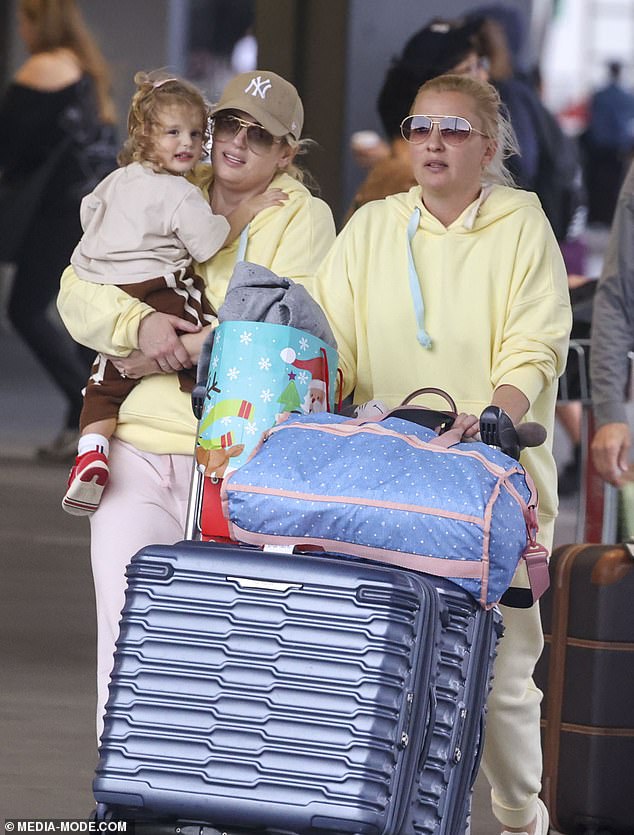 The Australian actress, 44, and her bride, 40, were spotted arriving at Sydney Airport with daughter Royce, 2, in tow