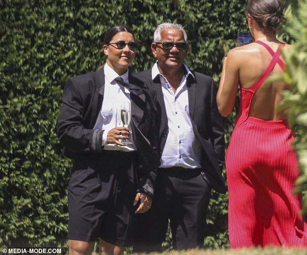 Kerr was also pictured enjoying the day with her father, Roger, as the Chelsea star wore a black tuxedo jacket, tie and shorts.