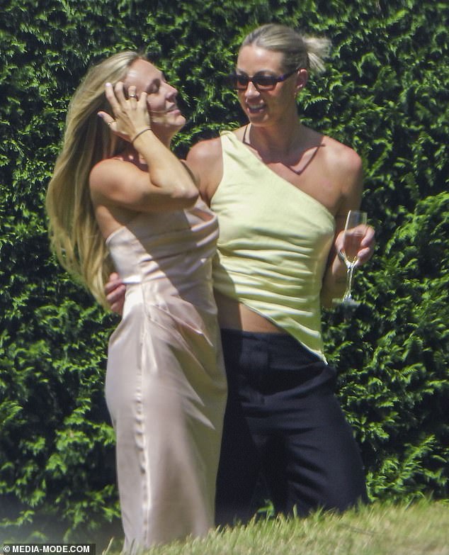 Manchester City and Australia star Alanna Kennedy (right) was also seen smiling while wearing a green top and black trousers