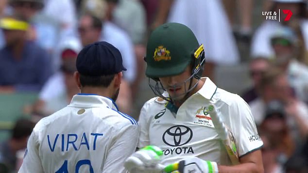 The moment Kohli (left) bumps his shoulder into Sam Konstas (right) as the 19-year-old raced to a stunning 60 on debut in the Boxing Day Test