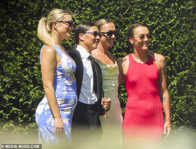 Emily Van Egmond's teammates were in attendance, along with Kerr (second from left) who posed for photos with her partner Kristie Mewis (left). Arsenal star Katie McCabe (second from right) and Caitlin Foord (right) had their photo taken with the couple