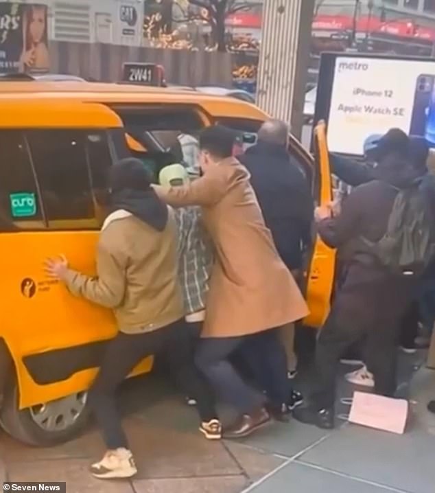 Bystanders rushed to free the pair by manually pushing the taxi away from them after Mrs Stewart's husband began screaming for help