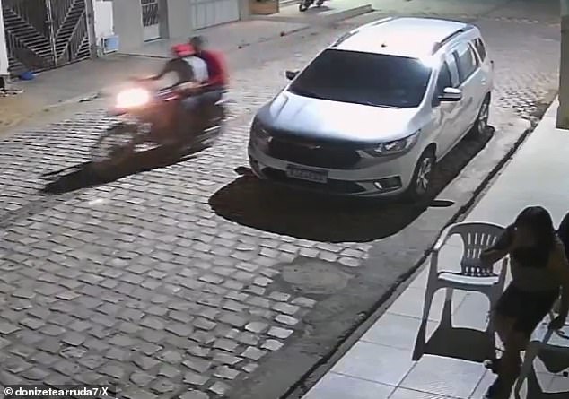 The suspects (left) fled on a motorcycle shortly after executing Marcos Araújo, a councilor in the city of Tabuleiro do Norte in northeastern Brazil.