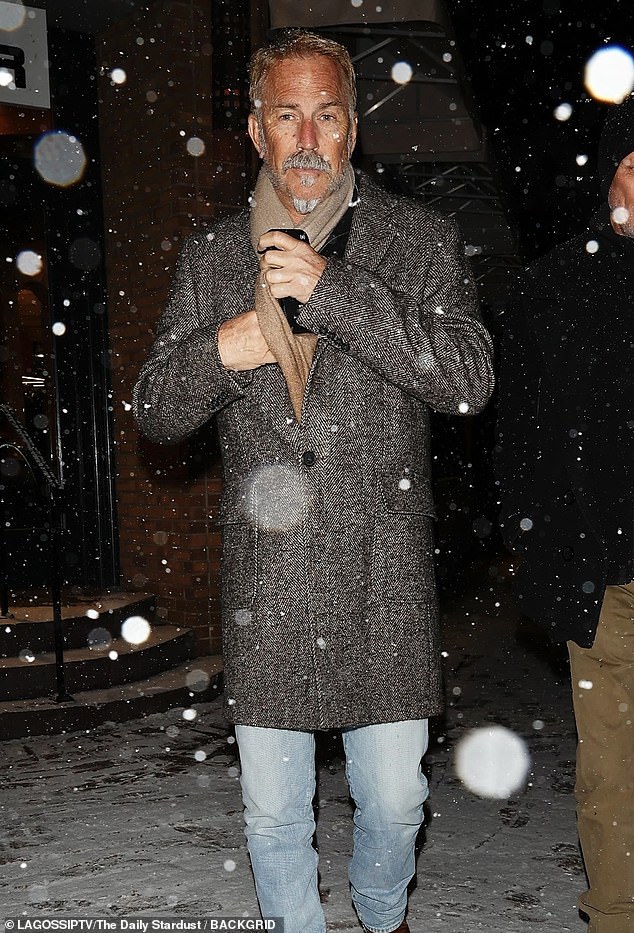 The Yellowstone star, 69, wore a long black and gray coat with a beige scarf, blue jeans and alligator boots as he left a restaurant with friends. He had a fresh tan and a neatly groomed silver fox goatee