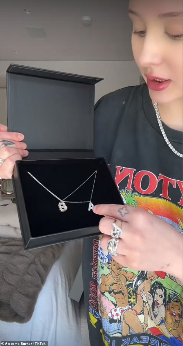 The diamond necklace above with her initials was a gift from her sister