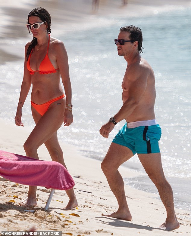 The 53-year-old actor and 46-year-old model showed off their impressively fit figures in barely-there swimwear