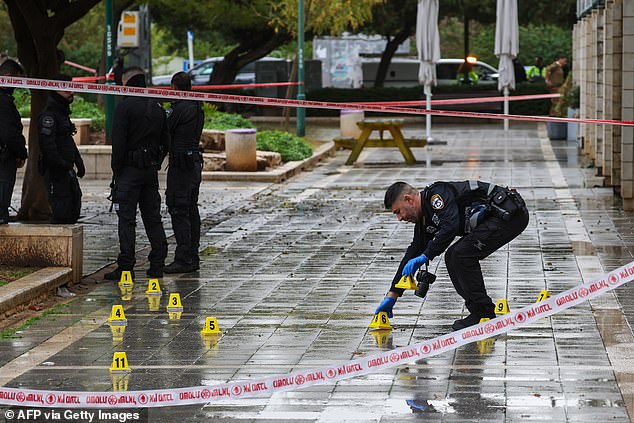 Israeli police monitor the scene of the stabbing, which was reportedly carried out by a former Shin Bet informant turned Palestinian terrorist