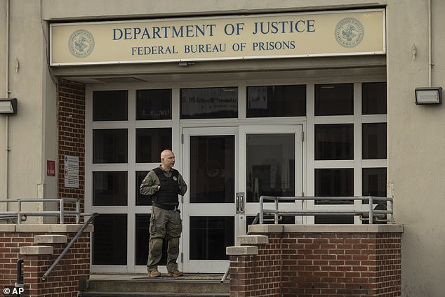 As the two high-profile inmates prepare for their shared stay, a prison expert has revealed that Mangione is likely to face strict rules including a 'fixed diet of anti-psychotic drugs'. Pictured: A federal enforcement officer stands outside the Metropolitan Detention Center in Brooklyn during an interagency operation