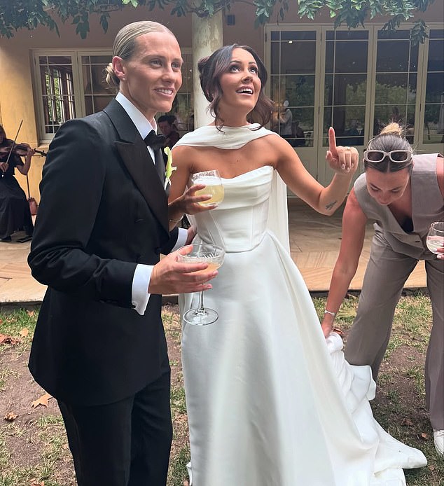 Kerr's old Matildas teammate Emily Van Egmond (left) was all smiles after marrying partner Kat Thompson