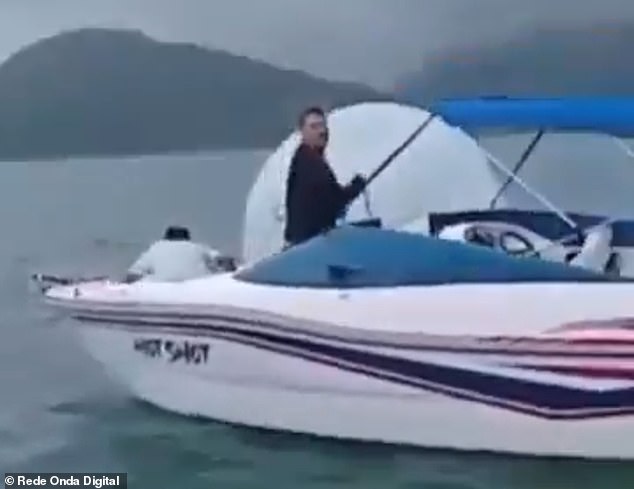 A man on board a boat was filmed attaching a cable to the bubble before dragging it with the child inside