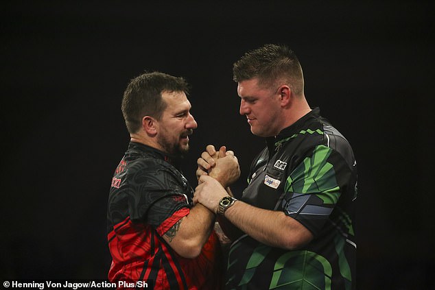 World number seven Clayton secured his place in the fourth round of the World Darts Championship after surviving a late attack from Daryl Gurney to win 4-3 at Alexandra Palace