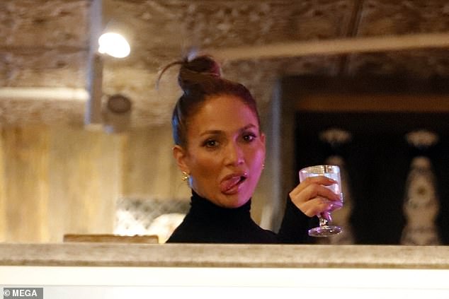 Jennifer was seen making a funny face as she relaxed with a drink