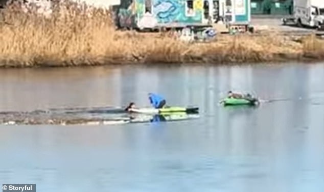 The 28-year-old can be seen pulling the troubled man onto the front of her paddleboard as she successfully rescues the unknown man