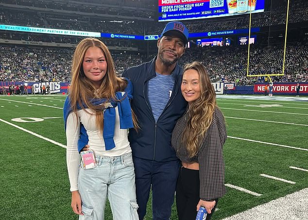 Strahan pictured with her father Michael, a Super Bowl winner with the New York Giants