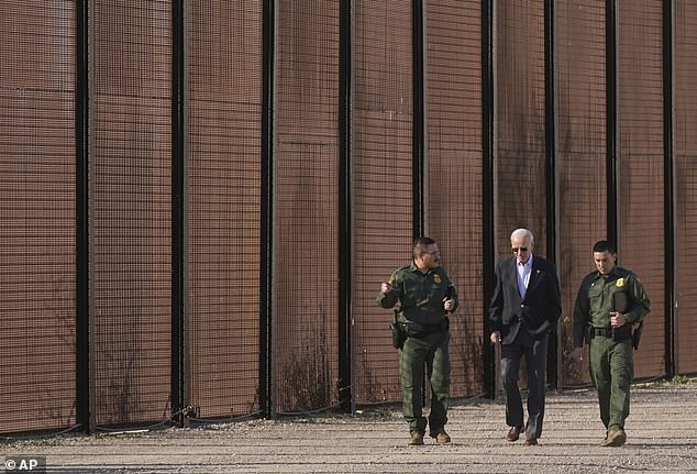 Joe Biden walks with U.S. Border Patrol agents along a stretch of the U.S.-Mexico border in El Paso, Texas, in January 2023