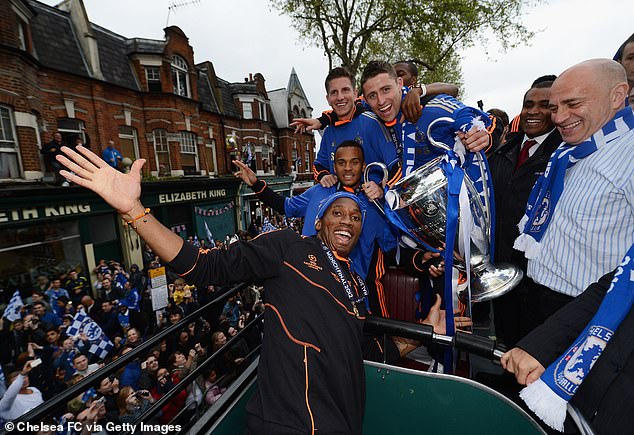 Bertrand drinks Chelsea's historic 2012 Champions League victory on an open-top bus alongside Didier Drogba (below), Sam Hutchinson (back left) and Gary Cahill (back right)