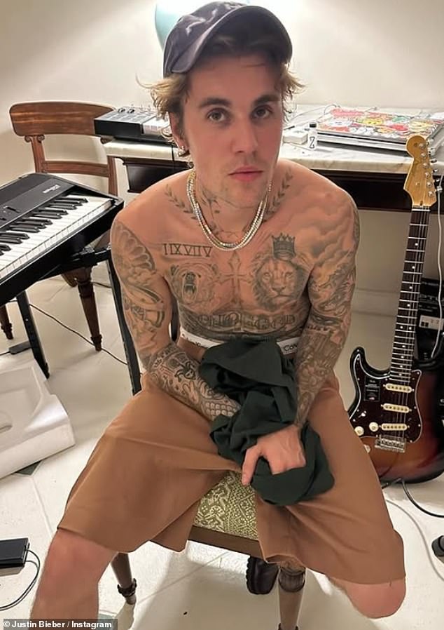 The 30-year-old pop star has long been open about his fervent Christianity and has had several tattoos with religious themes; photo early this year