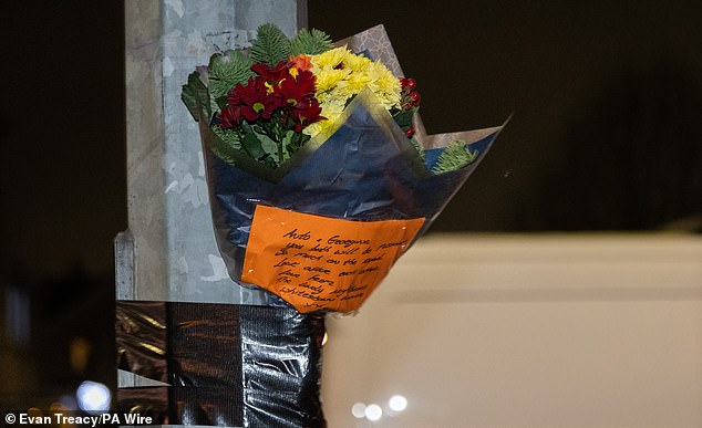 Flowers with a message for the couple were also left at the scene of the horror smash