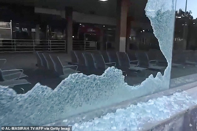 Broken glass at Sanaa airport. Mr Ghebreyesus said: 'As we were about to board our flight from Sanaa about two hours ago, the airport was hit by aerial bombardment'