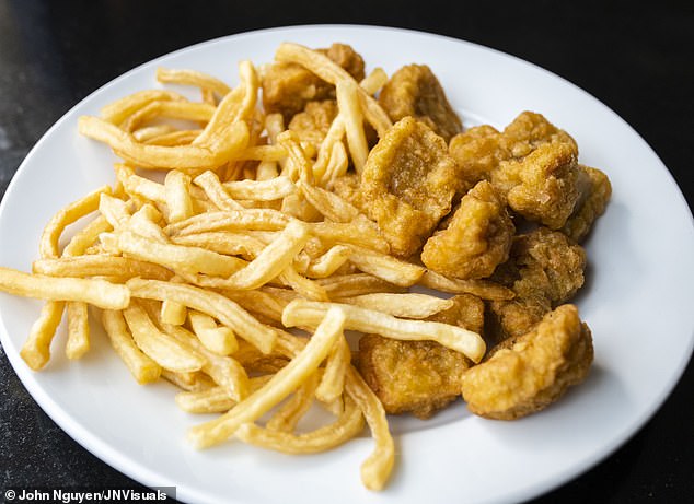 Chicken nuggets and chips (stock image). A ban on junk food advertising recently announced by Labor means that from October next year it will be illegal to advertise 'less healthy' food and drink on TV before the 9pm watershed and at any time online.