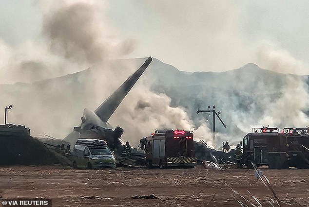 Photos from the scene show the tail of the plane surrounded by debris billowing smoke as firefighters battle the blaze