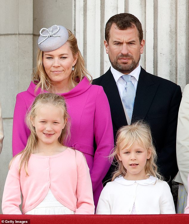 Autumn Kelly and Peter Phillips with their daughters Savannah and Isla on the balcony of Buckingham Palace in 2019