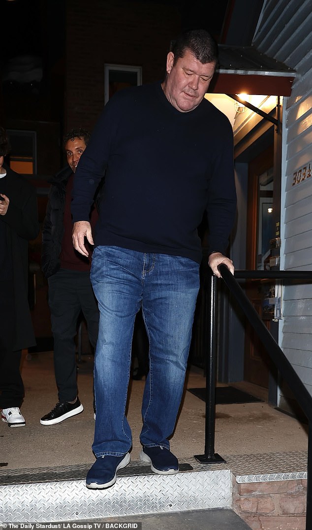 The 57-year-old was dressed casually in a navy blue sweater that hugged his slimmer figure. The former chairman of Crown Resorts added jeans and sneakers