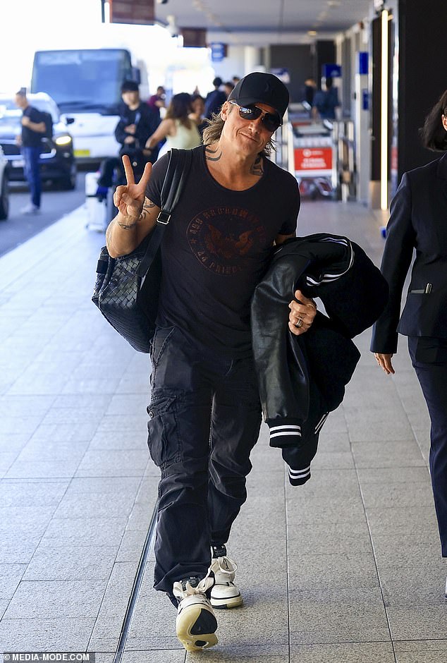 Keith, meanwhile, kept it casual as he crossed the terminal at Kingsford Smith Airport with a backpack slung over one shoulder