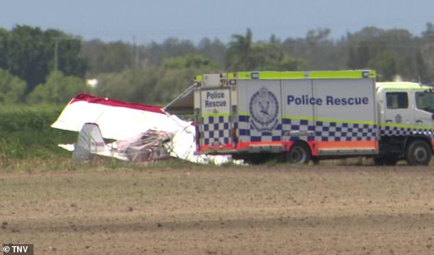 Images from the crash site showed dozens of emergency workers and bystanders near the wreckage near the dusty runway (photo)