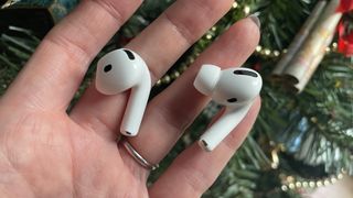 AirPods 4 and AirPods Pro 2, held together to show the differences