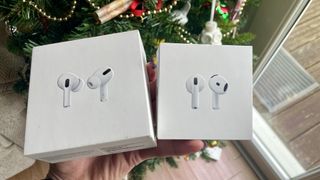 AirPods 4 and AirPods Pro 2, held together to show the differences