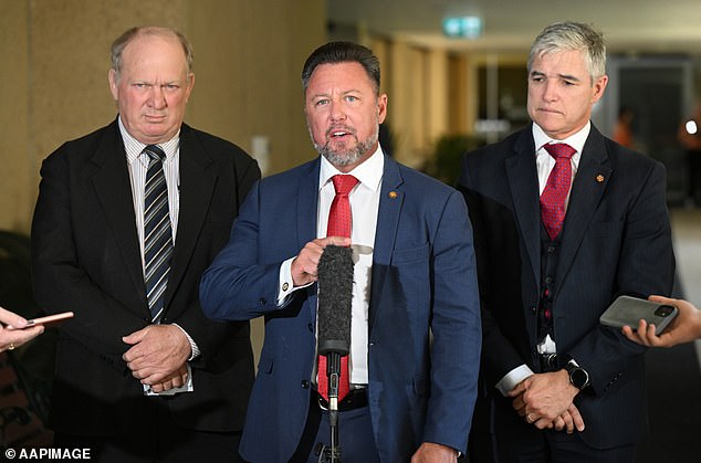 Nick Dametto (centre) said the Queensland Government should cancel outstanding Covid fines as an act of good faith to the public