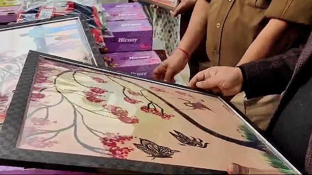 Artwork created by Mann while she was in prison was presented to charity workers