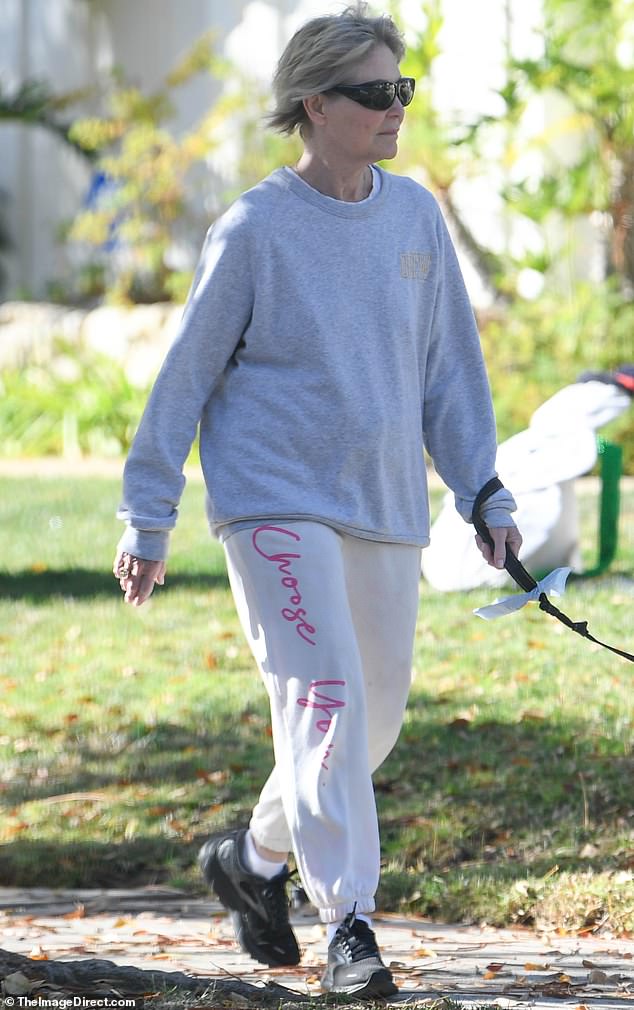 She also wore a pair of stylish black sunglasses to protect her eyes from the bright Californian sun during the peaceful stroll