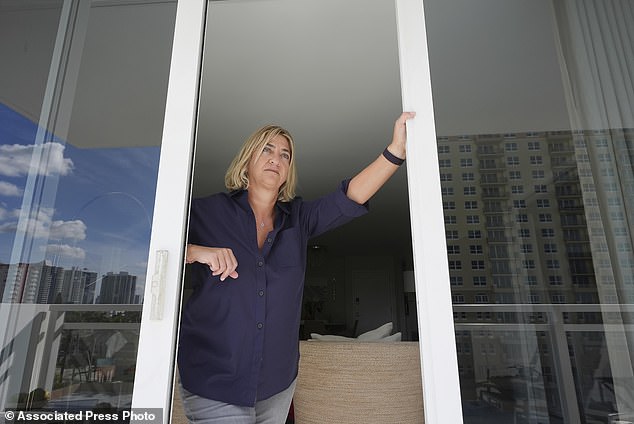 Condo owner Kelli Roiter looks from her balcony at other waterfront high-rises (AP Photo/Marta Lavandier)