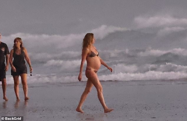 Gisele looked absolutely stunning as she basked in the sun in her skimpy swimsuit.