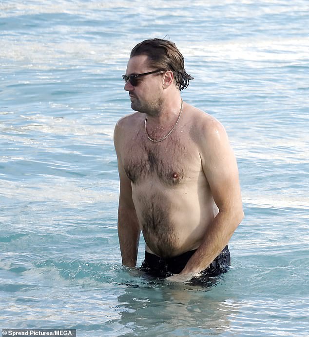 Meanwhile, Leonardo showed off his Harry chest with a gold chain and wore black swimming trunks