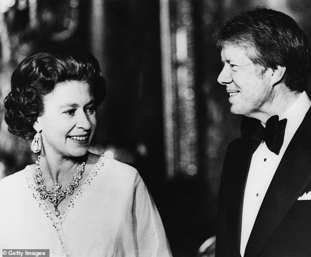 Carter is depicted with the Queen. He and other NATO heads of state attended a dinner at the palace on May 10, 1977