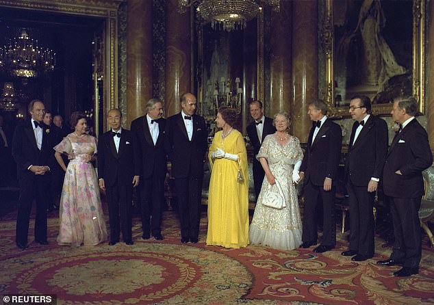 Canadian Prime Minister Pierre Trudeau (Prince Charles in the far background), Princess Margaret, Japanese Prime Minister Takeo Fukuda, British Prime Minister James Callaghan, French President Valery Giscard d'Estaing, Queen Elizabeth II, Prince Philip, Queen Mother, Jimmy Carter, Italian Prime Minister Giulio Andreotti and German Chancellor Helmut Schmidt (LR) in London, May 13, 1977