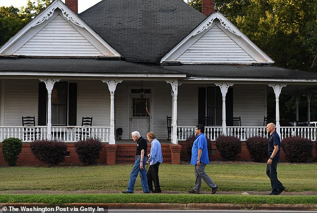 Jimmy and Rosalynn walked through Plains with their bodyguards in August 2018