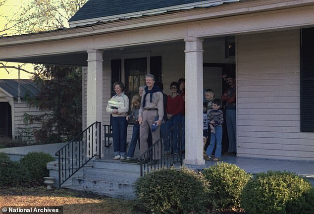 Carter is pictured celebrating Christmas at his home with his family in 1978