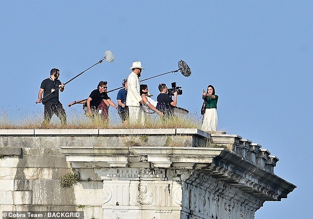 In October, the Quiet music video star reprized her roles as Giulietta Tosches/Gemma Donati on the Italian set of Julian Schnabel's $25 million budget drama In the Hand of Dante (pictured October 7)