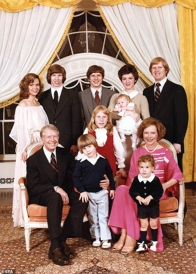 Carter and his family posed for their White House portrait (pictured). Carter had four children and more than twenty grandchildren and great-grandchildren