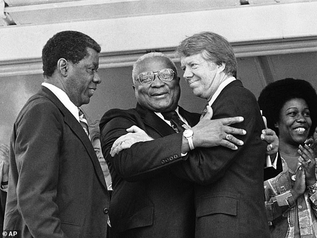 Carter and Rev. Dr. Martin Luther King Sr. hugged each other during a campaign rally, where the activist supported the Democratic candidate in 1976 (photo)