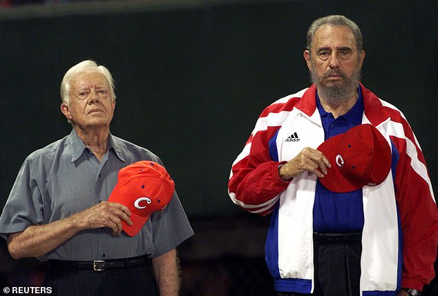 Carter, known for his diplomacy, stood with Cuban President Fidel Castro at a baseball game in 2002 (pictured)