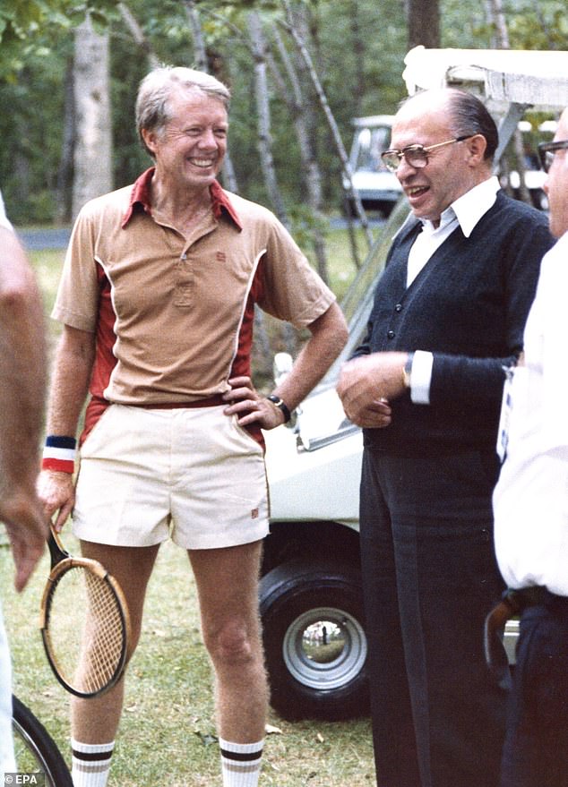 Carter rubbing elbows with Israeli Prime Minister Menachem Begin during Middle East peace talks at Camp David (photo)