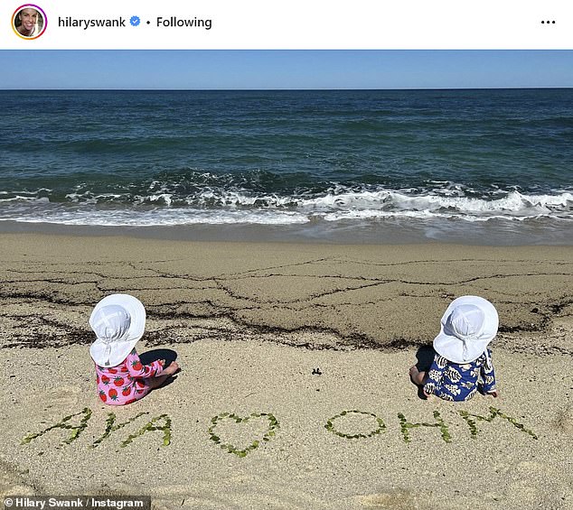 In her photo, she posed with her hand on top of daughter Aya or son Ohm's head as they admired the ornaments.