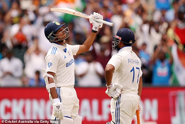 Jaiswal is pictured saluting the crowd after rubbing salt in Australia's wounds by recording a very timely half-century on Monday