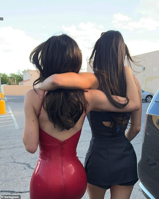 Kylie added a photo of herself walking with her arm around a faceless beauty, believed to be her sister Kendall